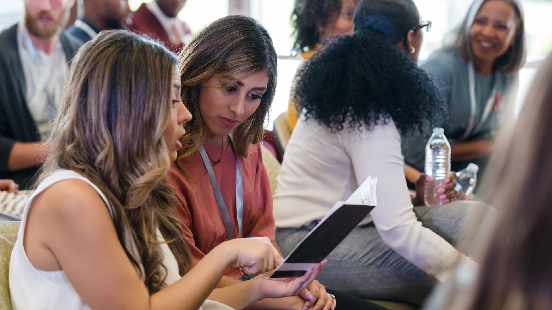Attendees reviewing materials during an event