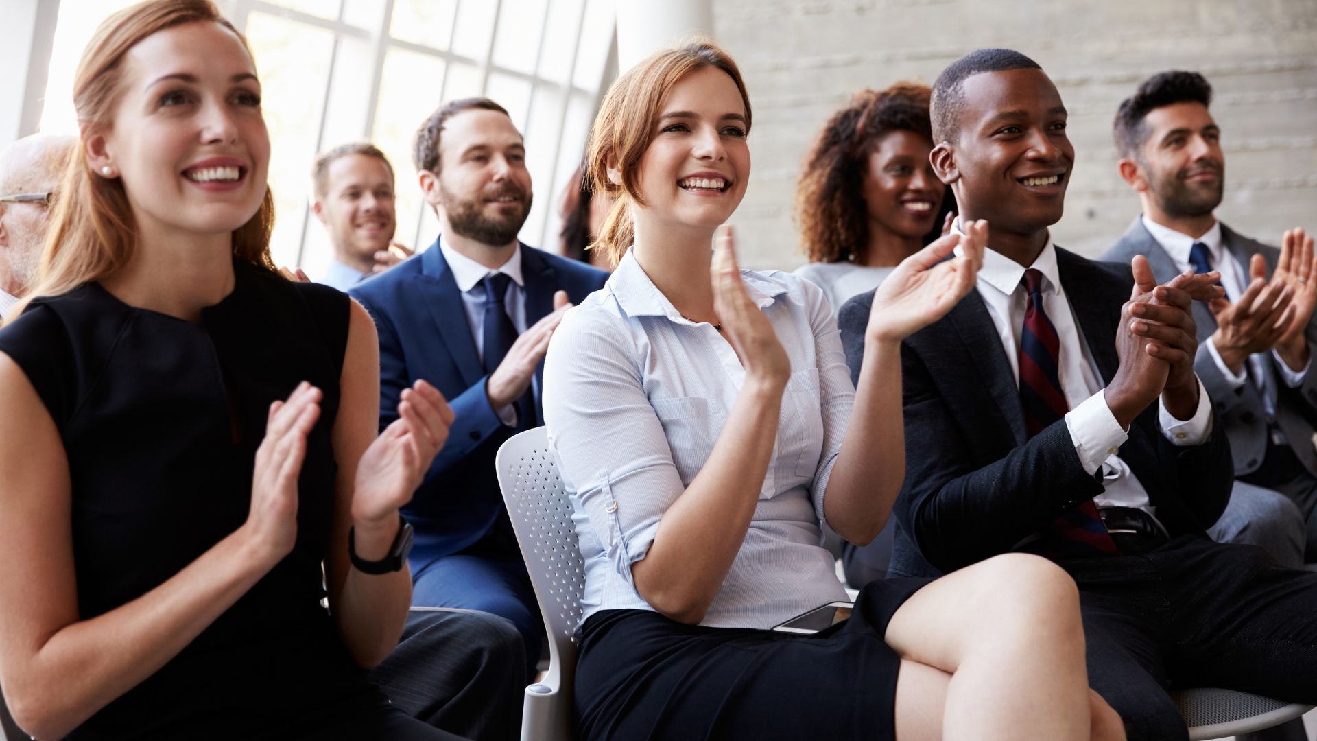 Audience applauding during a session