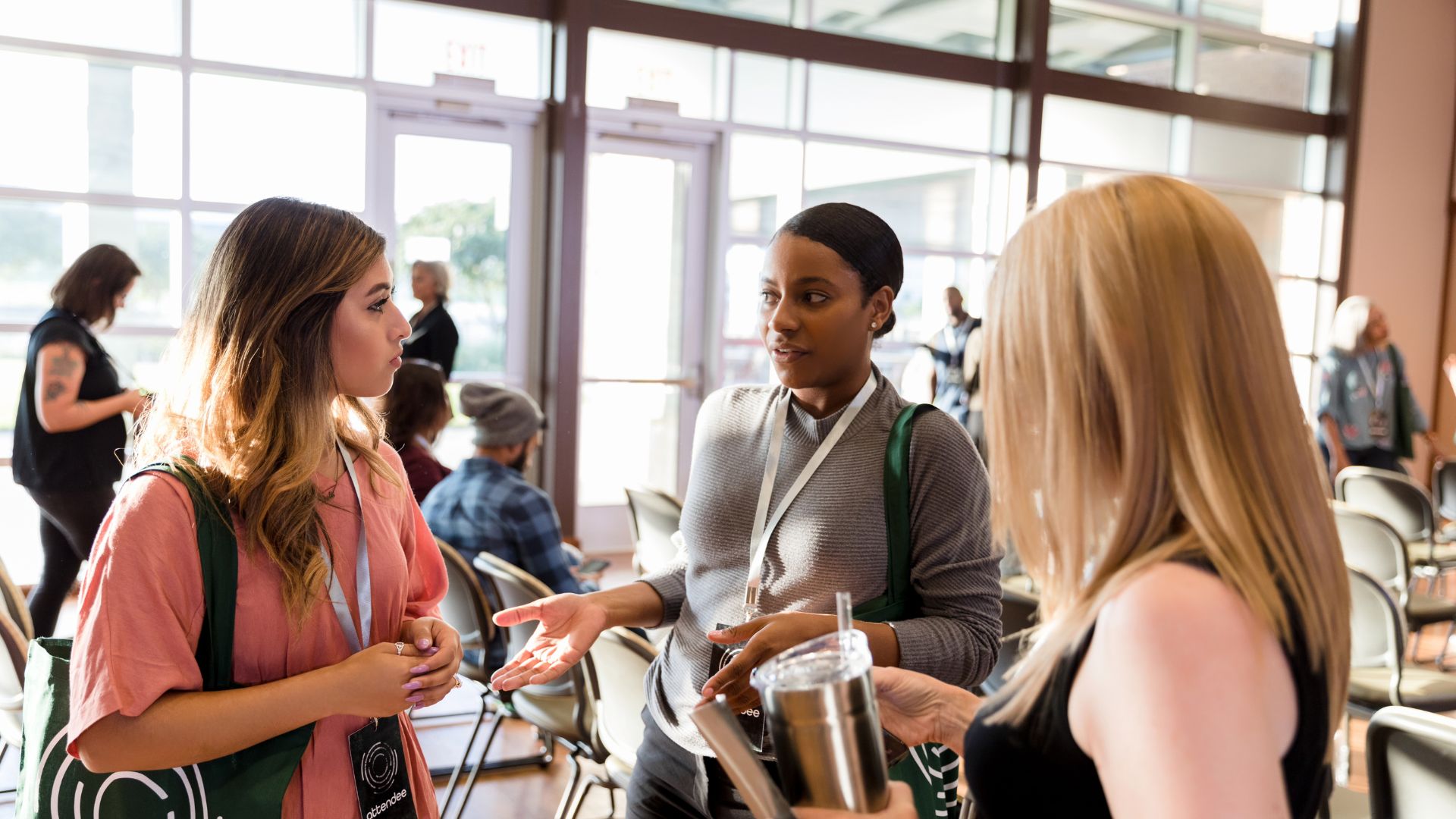 Attendees having a focused sponsor conversation