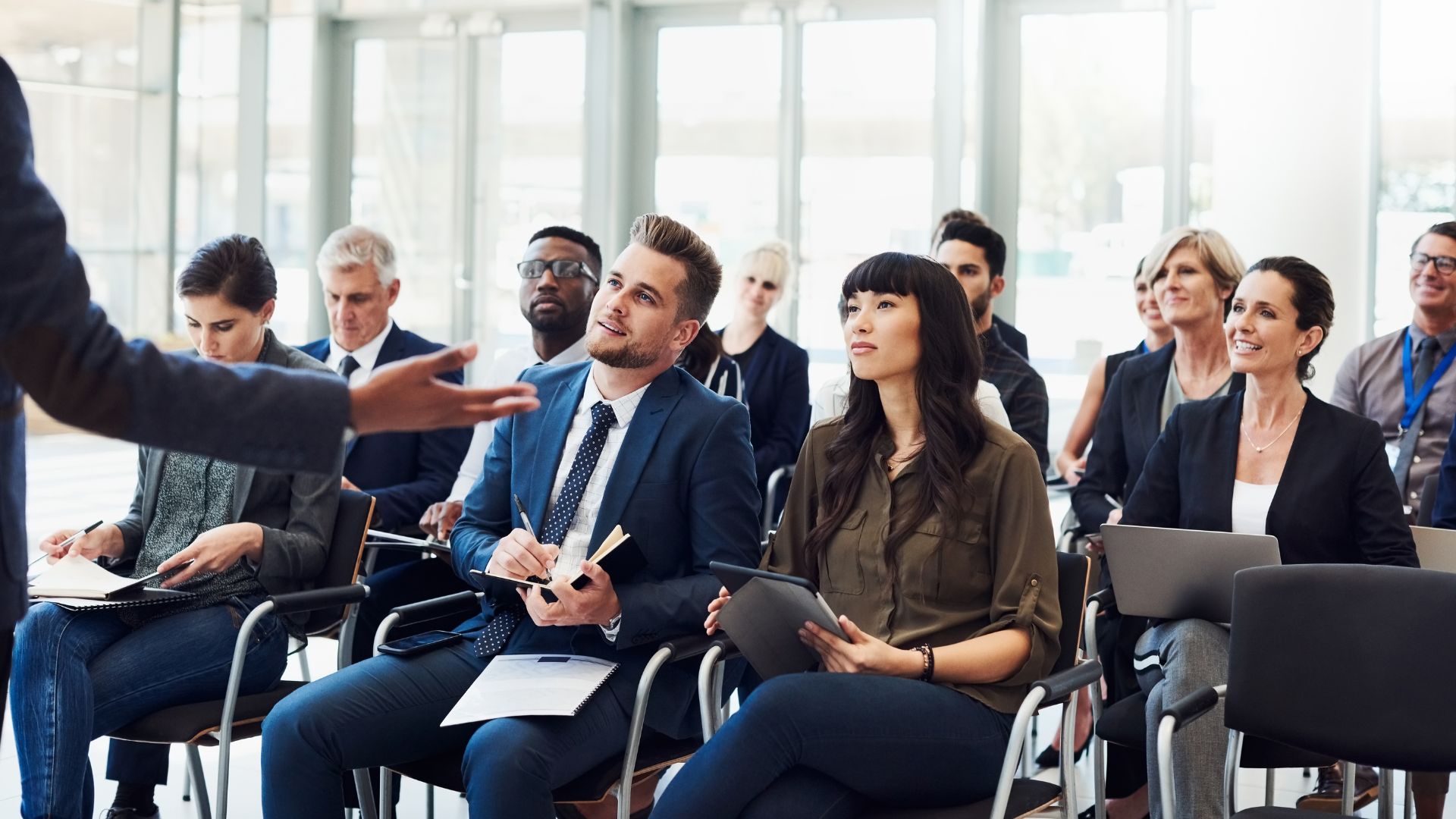 Audience engaged in a focused executive session