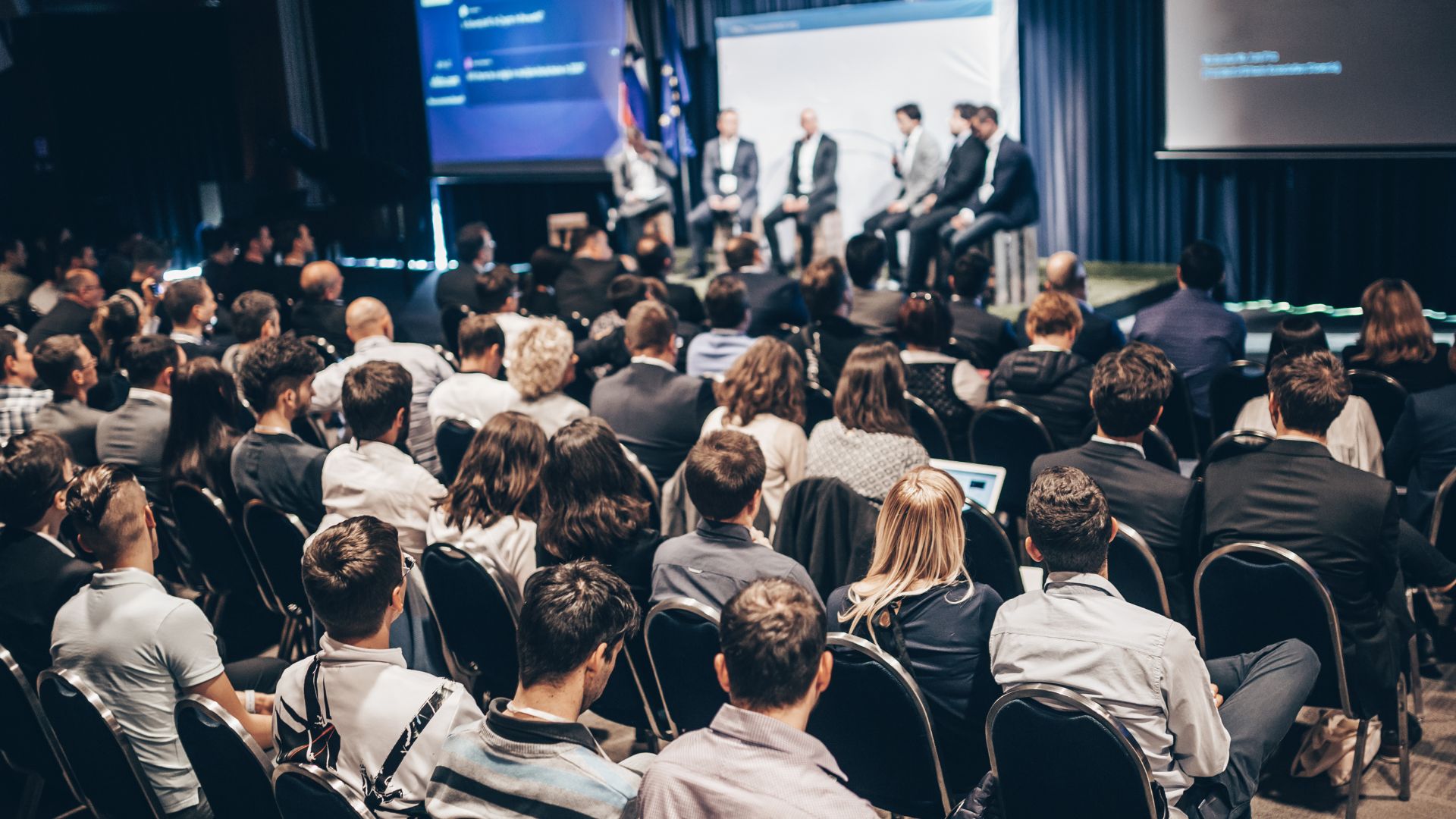 Audience attending a panel discussion
